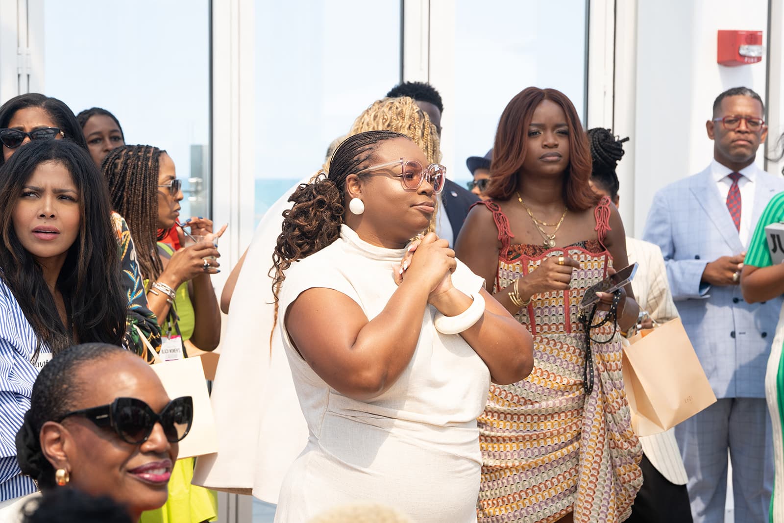 Attendee listening at the Colored Girls Brunch event